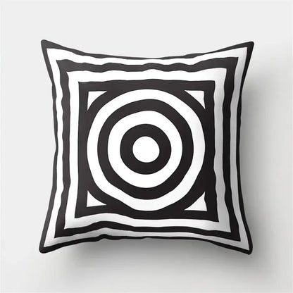 Black and white geometric star pillow cover with concentric circles and layered square borders for home decor by decorbites