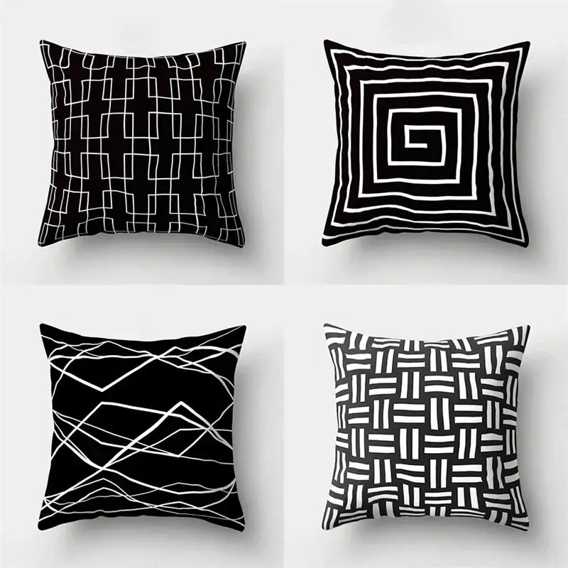 Set of four black and white geometric star print pillow covers for home decor by decorbites