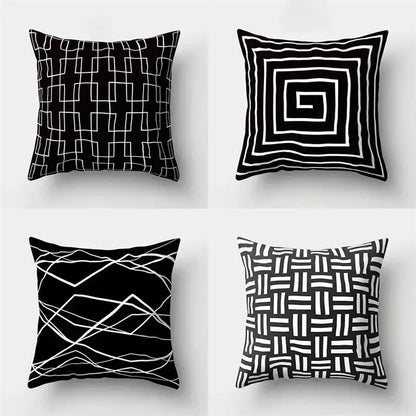 Set of four black and white geometric star print pillow covers for home decor by decorbites