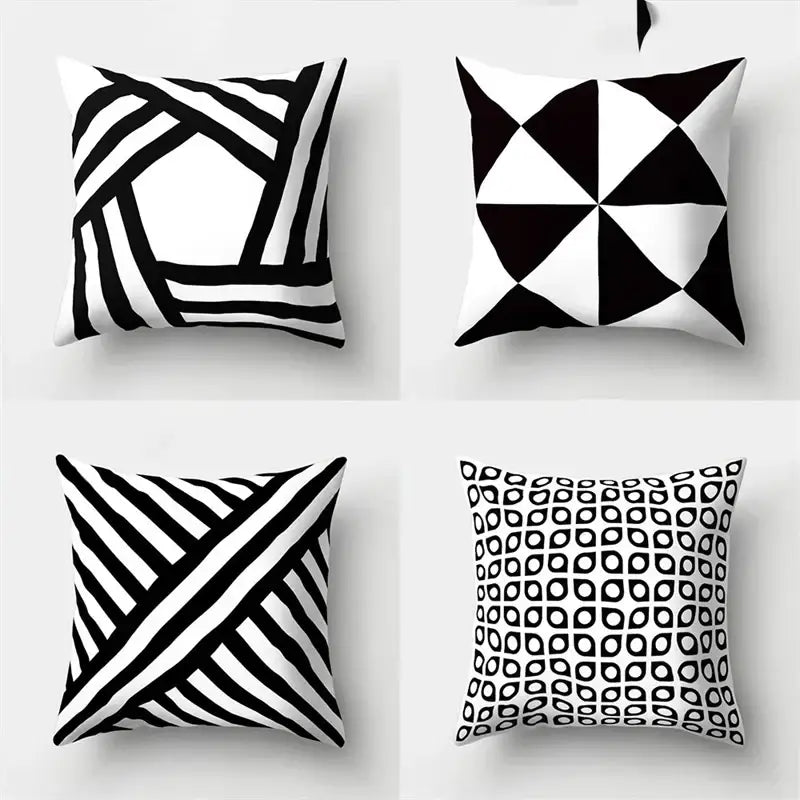 Set of four black and white pillow covers with geometric star print for home decor by decorbites