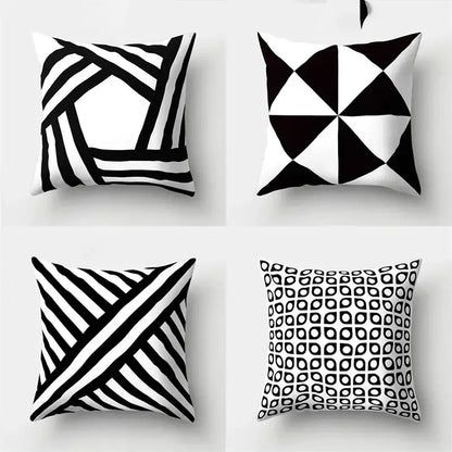 Set of four black and white pillow covers with geometric star print for home decor by decorbites