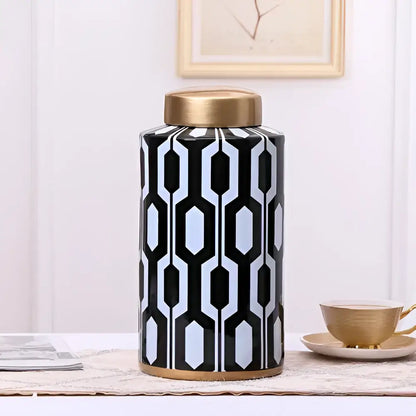 Black and white geometric stripes ceramic storage jar with gold-toned lid and base for living room decorbites decor