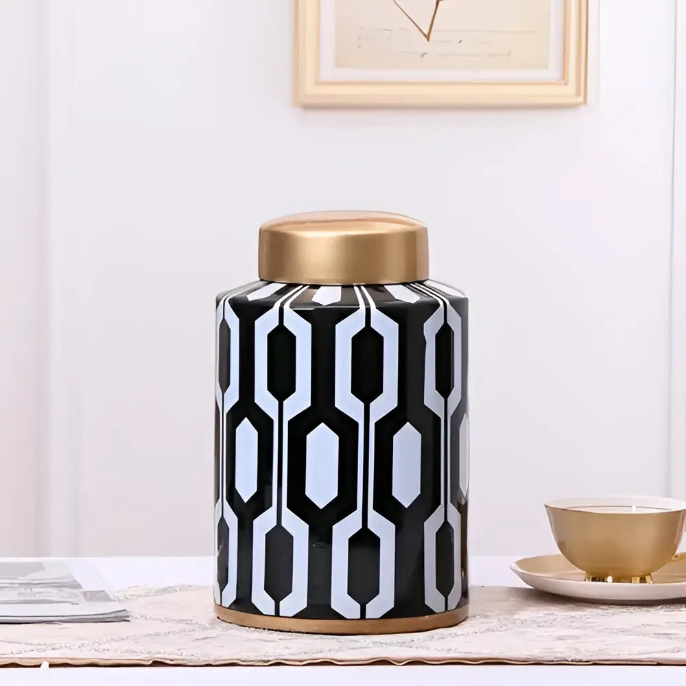 Black and white geometric stripes ceramic storage jar with gold-toned lid and base for living room decorbites decor