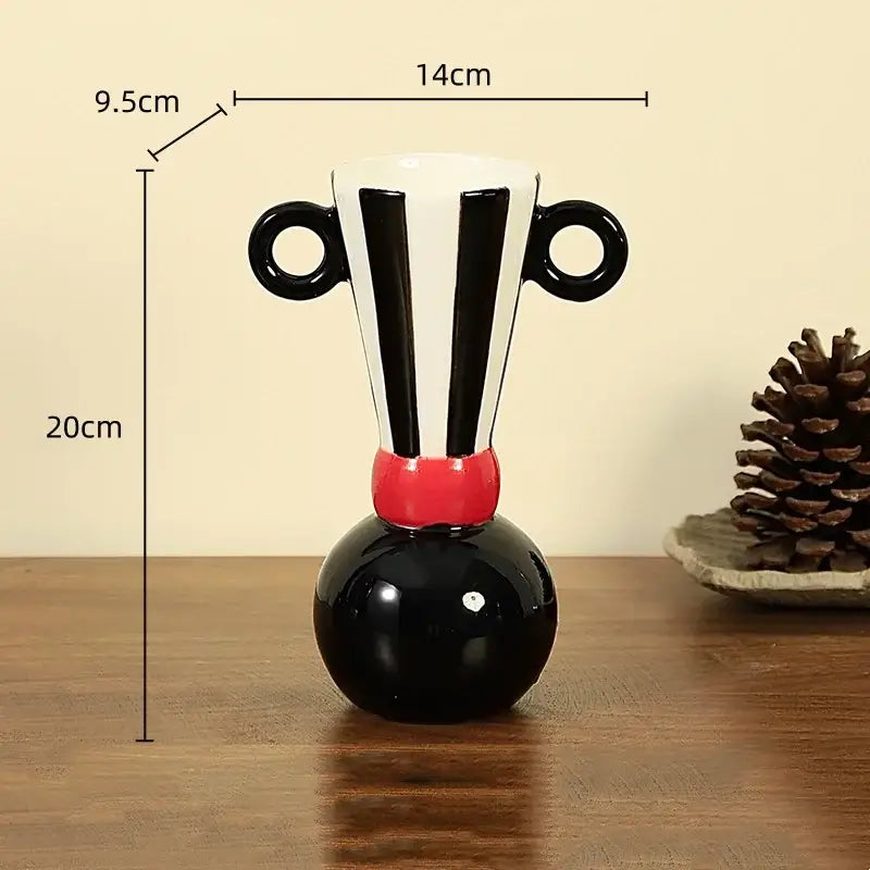 Black and white ceramic vase with geometric stripes and red accent featuring two circular handles for living room decorbites geometric stripes ceramic decor