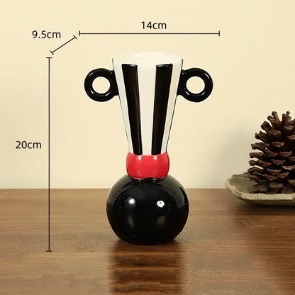 Black and white ceramic vase with geometric stripes and red accent featuring two circular handles for living room decorbites geometric stripes ceramic decor
