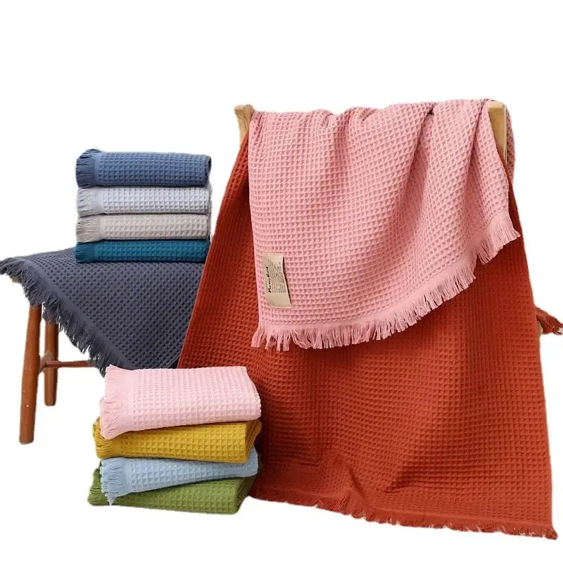 Soft pink bath towel with geometric tassel multi colored waffle design and fringed edges for decorbites geometric tassel bath decor