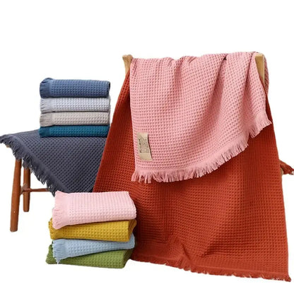 Soft pink bath towel with geometric tassel multi colored waffle design and fringed edges for decorbites geometric tassel bath decor