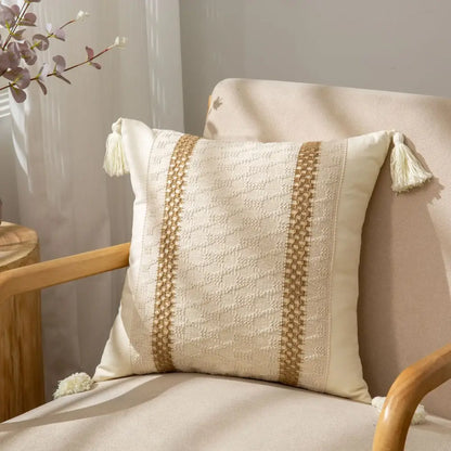 Cream-colored cushion cover with textured beige woven stripes and tassels for decorbites geometric tassel decor