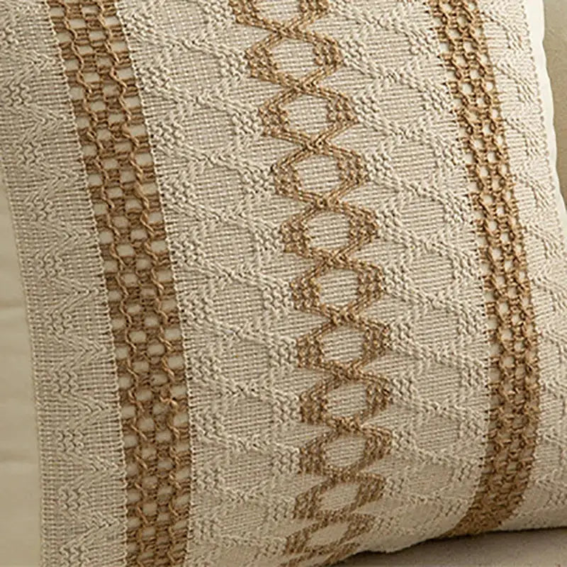 Beige cushion cover with textured woven fabric and tan braided cord geometric tassel decorbites geometric tassel cushion