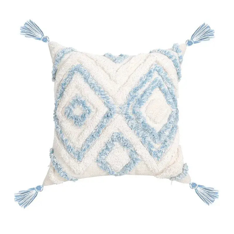 Cream-colored pillow cover with light blue geometric tassel tufted embroidery and matching tassels for living room décor