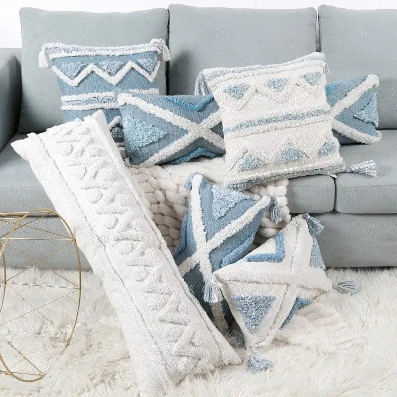 Set of geometric tassel tufted blue and white pillow covers with star patterns and textured tassels for living room