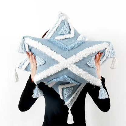 Light blue star-shaped pillow cover with white textured trim and geometric tassel tufted design for living room
