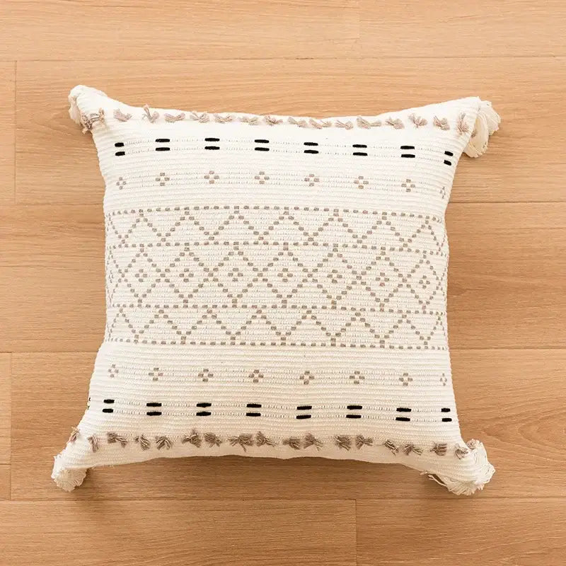 Cream-colored woven cushion cover with geometric tufted beige patterns and fringed edges for living room decorbites decor