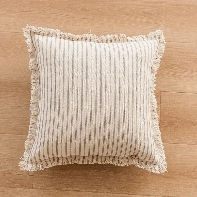 Beige and gray vertically striped geometric tufted cushion cover with frayed edges and tassel trim for decorbites living room decor