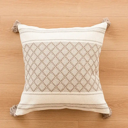 Beige and cream woven cushion cover with diamond-patterned geometric tufted embroidery and tassel trim for living room decorbites decor