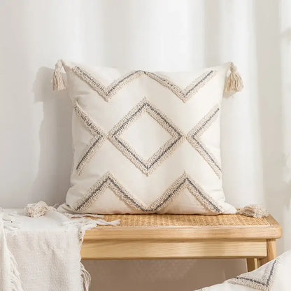 Cream-colored geometric tufted pillow covers with black and beige woven lines and tassels for living room decorbites decor