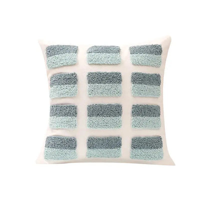 Off-white pillow cover with geometric tufted diamond pattern in teal, blue, and gray for living room decorbites decor
