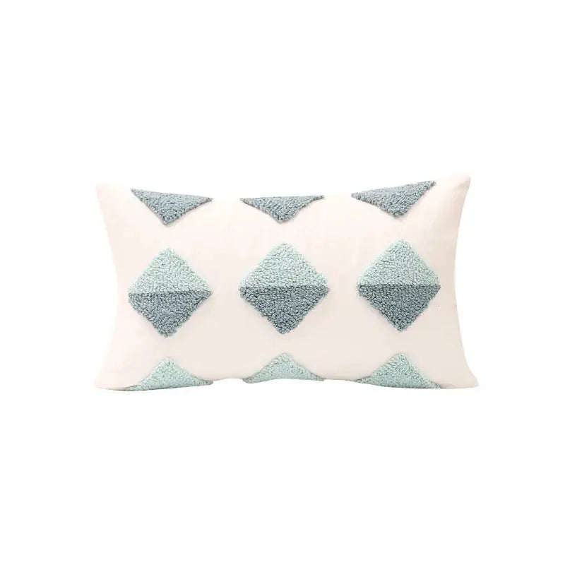 Cream-colored pillow cover with textured light blue geometric tufted diamond appliqués for living room decorbites decor