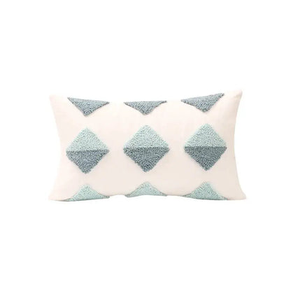 Cream-colored pillow cover with textured light blue geometric tufted diamond appliqués for living room decorbites decor