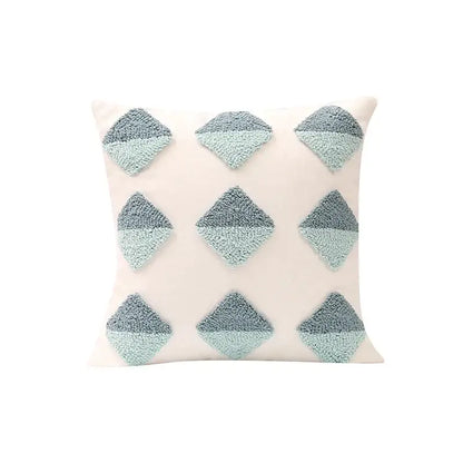 Cream-colored pillow cover with nine two-tone gray and mint green geometric tufted diamond appliqués for decorbites decor