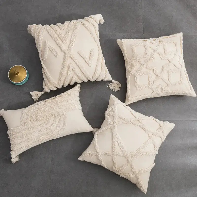Cream-colored cushion cover with intricate woven geometric tufted fringed patterns for living room decorbites decor