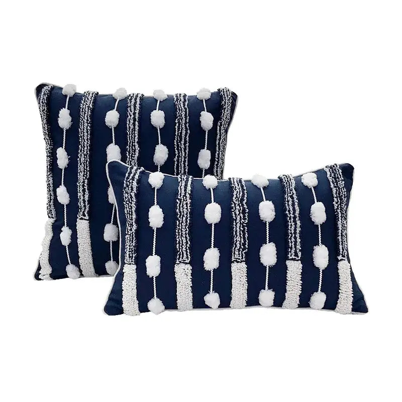 Navy blue rectangular geometric tufted cushion cover with white pom-pom and textured stripe decorbites geometric tufted accents