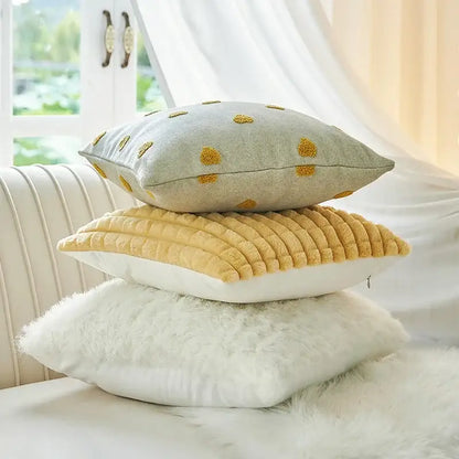 Stacked soft gray mustard yellow and white cushion covers with decorbites geometric tufted plush texture for living room decor