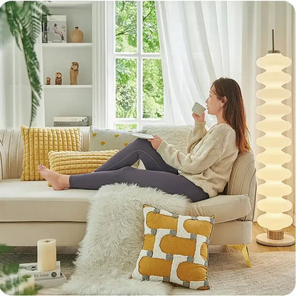 Cream-colored plush armchair with gold-tone legs featuring decorbites geometric tufted plush cushion cover in mustard and white