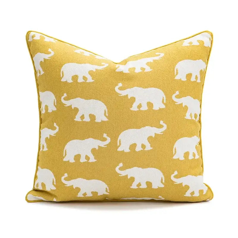 Yellow cushion cover featuring white elephant silhouettes and geometric tufted plush design for living room decorbites decor