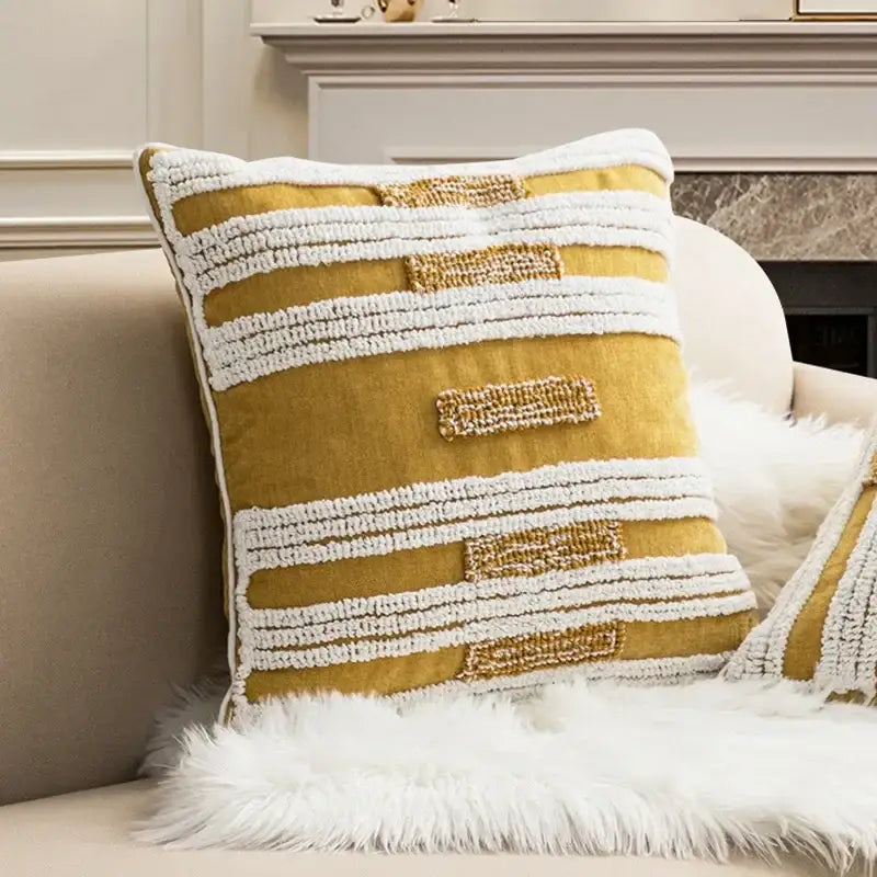 Mustard yellow cushion cover with white and gold embroidered stripes featuring decorbites geometric tufted plush design