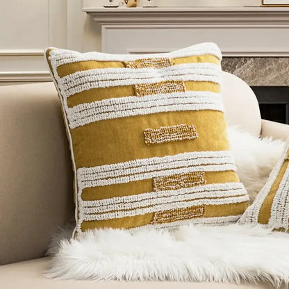 Mustard yellow cushion cover with white and gold embroidered stripes featuring decorbites geometric tufted plush design