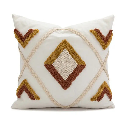 Cream-colored geometric tufted plush cushion cover with mustard and terracotta pattern and braided rope accents for decorbites