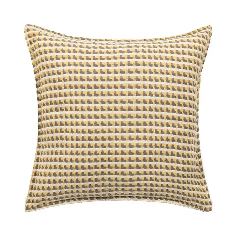 Square geometric tufted plush cushion cover with brown boot motifs on mustard and white striped background by decorbites