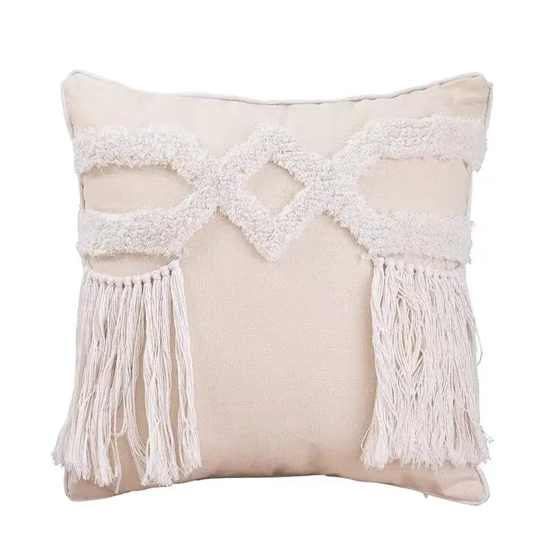 Beige cushion cover with white macrame-style fringe and tassels from decorbites geometric tufted tassel collection