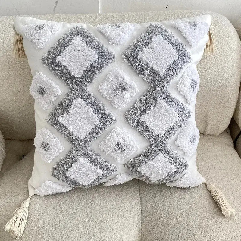 White and gray textured geometric tufted tassel cushion cover with diamond patterns and cream tassels for living room decor