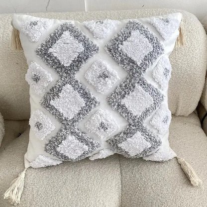 White and gray textured geometric tufted tassel cushion cover with diamond patterns and cream tassels for living room decor