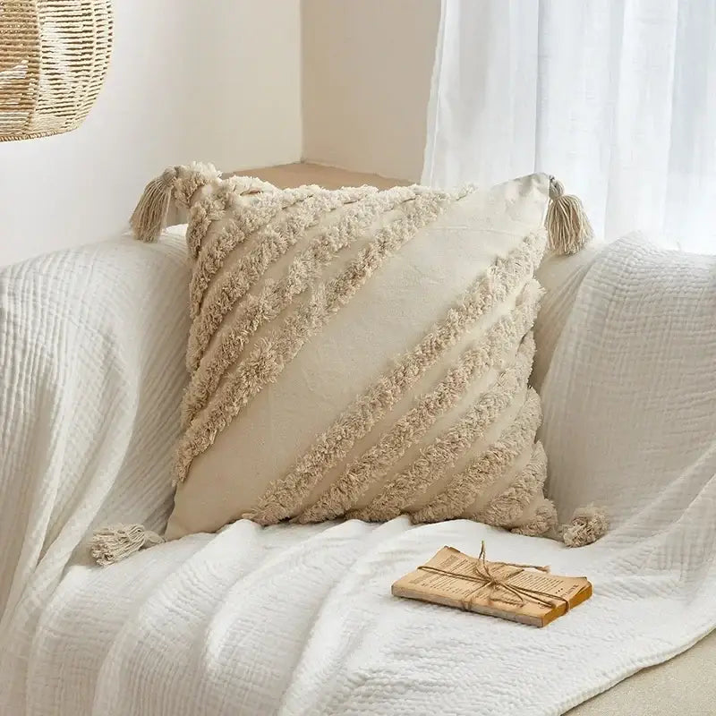Cream-colored geometric tufted tassel cushion cover with textured fringed stripes and tassels for living room decor
