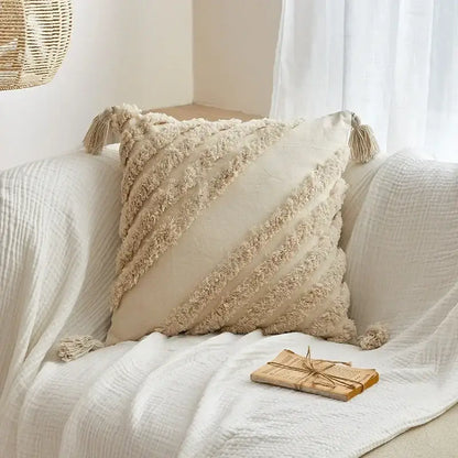 Cream-colored geometric tufted tassel cushion cover with textured fringed stripes and tassels for living room decor