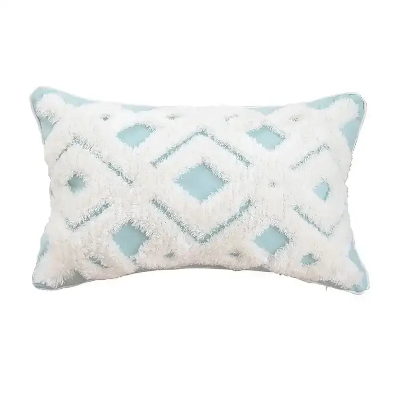 A rectangular beige and gray cushion cover with geometric tufted tassel design and white fluffy fringe for living room decor
