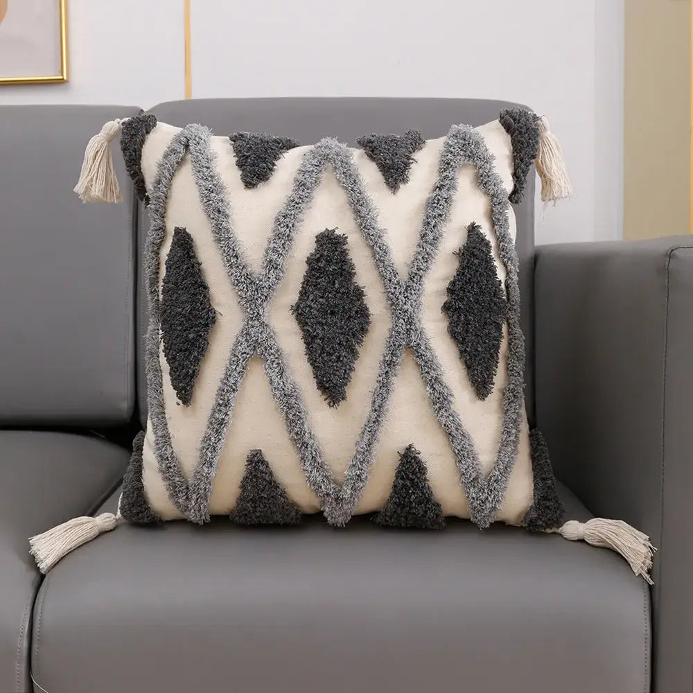 Cream-colored cushion cover with decorbites geometric tufted tassel pattern in beige and gray for living room decor