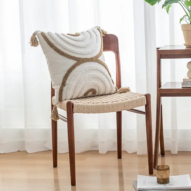 Cream-colored geometric tufted tassel cushion cover with beige yarn concentric patterns and decorative tassels for living room decor