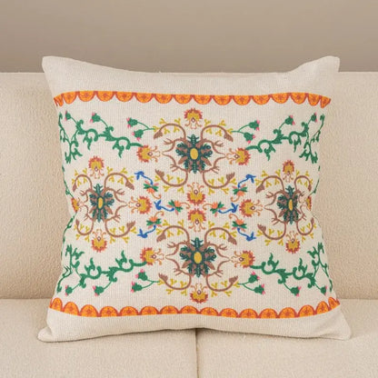 Off-white cushion cover with intricate embroidered floral vines and scalloped border for geometric tufted tassel decor