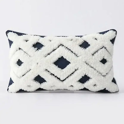 Rectangular cushion cover with bold black and white geometric tufted tassel pattern on dark navy background decorbites geometric tufted