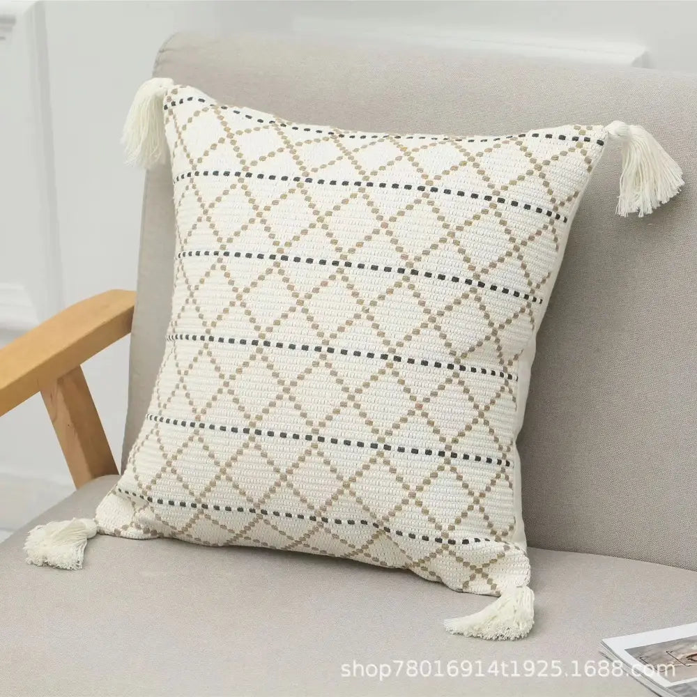 Cream-colored woven geometric tufted tassel cushion cover with black and beige diamond pattern for living room decorbites decor