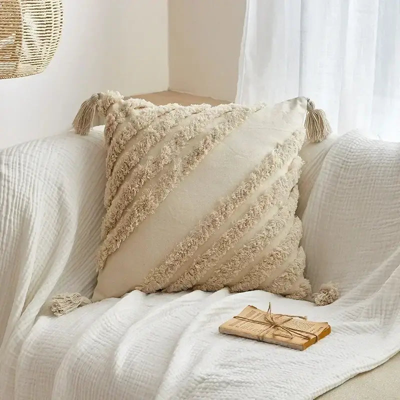 Cream-colored cushion cover with textured fringed stripes and tassels for decorbites geometric tufted tassel decor
