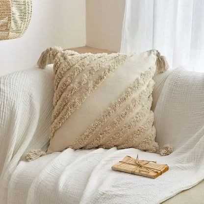 Cream-colored cushion cover with textured fringed stripes and tassels for decorbites geometric tufted tassel decor