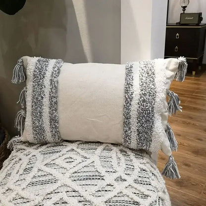 Rectangular off-white cushion cover with geometric tufted tassel design in beige and gray for living room decor