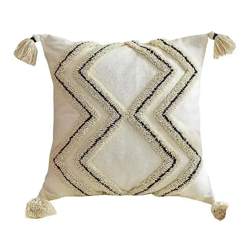 Cream-colored cushion cover with decorbites geometric tufted tassel design and matching tassels for beige gray decor