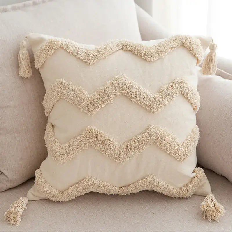 Cream-colored geometric tufted tassel pillowcase in beige cotton linen with wavy fringe pattern for living room decor