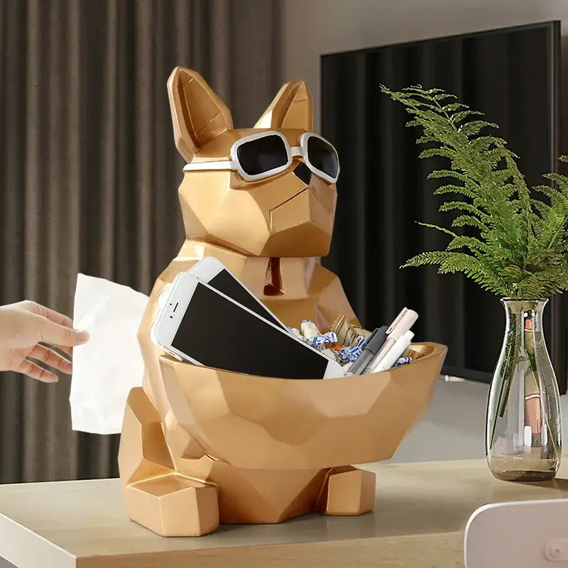 Gold-colored geometric french bulldog tissue box holder with sunglasses serving as stylish desk organizer